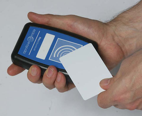 Hand holding RFID tag to Ensemble Tag
